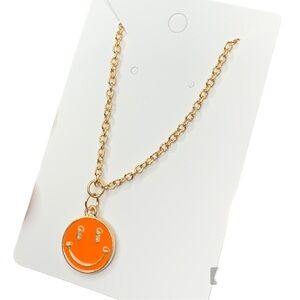Orange and gold smiley face necklace